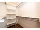 Well-organized walk-in closet with ample shelving and a hanging rod for storage at 36635 View Ridge Dr, Elizabeth, CO 80107