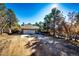 Inviting single-Gathering home with a two-car garage surrounded by lush greenery and a bright blue sky at 36635 View Ridge Dr, Elizabeth, CO 80107