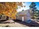 Two-car garage exterior view featuring autumn trees at 36635 View Ridge Dr, Elizabeth, CO 80107