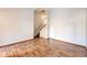 Open living room with wood laminate flooring, showcasing the staircase to the upper level and a bright, airy feel at 36635 View Ridge Dr, Elizabeth, CO 80107