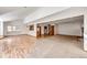 Open-concept living room featuring wood floors, carpet, and ample natural light from large windows at 36635 View Ridge Dr, Elizabeth, CO 80107