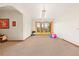 Open carpeted room with access to the outdoors, suitable for various activities and relaxation at 4560 Hilltop Rd, Evergreen, CO 80439