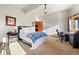 Well-lit bedroom with a comfortable bed, desk, and stylish Western-themed accents at 4560 Hilltop Rd, Evergreen, CO 80439
