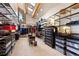 Spacious walk-in closet with custom shelving, clothing racks, and beautiful natural light from the skylight at 4560 Hilltop Rd, Evergreen, CO 80439