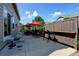 Outdoor patio featuring seating, a red umbrella, mature foliage and an outdoor bar top at 9046 Sandpiper Dr, Frederick, CO 80504