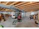 Unfinished basement with open ceilings, concrete floors, and a desk/storage area ready for customization at 9046 Sandpiper Dr, Frederick, CO 80504