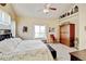 Comfortable bedroom with ample natural light, carpet, decor shelving, and a spacious layout at 9046 Sandpiper Dr, Frederick, CO 80504