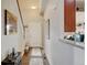 Bright entryway with hardwood floors, staircase, and access to the kitchen and other living areas at 9046 Sandpiper Dr, Frederick, CO 80504