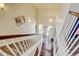 Bright entryway with hardwood floors, a stairway, and an open door welcoming you into the home at 9046 Sandpiper Dr, Frederick, CO 80504