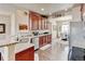 Gourmet kitchen featuring stainless steel appliances, granite counters, and an adjacent dining area at 9046 Sandpiper Dr, Frederick, CO 80504
