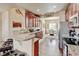 A spacious kitchen features granite countertops, stainless steel appliances, and hardwood floors at 9046 Sandpiper Dr, Frederick, CO 80504