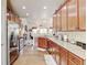Modern kitchen with stainless appliances, granite countertops and hardwood flooring throughout at 9046 Sandpiper Dr, Frederick, CO 80504