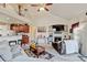 Cozy living room with a fireplace and open layout with the kitchen area at 9046 Sandpiper Dr, Frederick, CO 80504