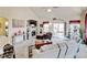 Inviting living room with vaulted ceiling, fireplace, and access to an outdoor patio at 9046 Sandpiper Dr, Frederick, CO 80504