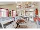 Spacious living room with vaulted ceiling, lots of light, and an adjacent dining area at 9046 Sandpiper Dr, Frederick, CO 80504