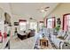 Bright living room with plush seating, vaulted ceilings, and a cozy fireplace at 9046 Sandpiper Dr, Frederick, CO 80504