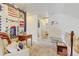 A spacious, naturally lit loft area with American-themed decor and cozy furnishings at 9046 Sandpiper Dr, Frederick, CO 80504