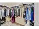 Spacious walk-in closet with double hanging rods for maximum storage and organization at 9046 Sandpiper Dr, Frederick, CO 80504