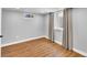 Minimalist room with hardwood floors, neutral walls, bright window and soft lighting perfect for relaxation at 1300 Cherry St, Denver, CO 80220