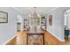 Inviting dining room boasts hardwood floors, contemporary lighting, and ample seating at 1300 Cherry St, Denver, CO 80220