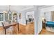 Charming dining room with hardwood flooring and an open doorway to an adjacent living space at 1300 Cherry St, Denver, CO 80220
