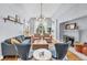 Bright living room showcasing hardwood floors, modern lighting, and a cozy fireplace at 1300 Cherry St, Denver, CO 80220