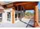 Spacious outdoor deck featuring log beams and architecture with a beautiful view of the landscape at 7076 Boreas Rd, Larkspur, CO 80118