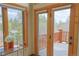 Scenic view from the balcony showcasing the surrounding trees and natural landscape at 7076 Boreas Rd, Larkspur, CO 80118