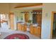 Bathroom featuring a double sink vanity with wood cabinetry and a spacious layout at 7076 Boreas Rd, Larkspur, CO 80118