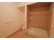 Well lit bathroom with tub and shower with showerhead and towel rack at 7076 Boreas Rd, Larkspur, CO 80118