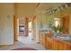 Bathroom with a fireplace and double sink vanity, combining rustic charm and modern convenience at 7076 Boreas Rd, Larkspur, CO 80118