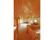 Open second story living area with wood ceilings, wood beam architecture, and carpet flooring at 7076 Boreas Rd, Larkspur, CO 80118