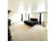 Large bedroom with carpet floors and natural lighting at 7435 E 159Th Pl, Thornton, CO 80602