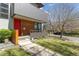 Stylish home with a bright red door and modern wood accents, plus professional landscaping at 1801 W 33Rd Ave, Denver, CO 80211