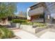Modern home showcasing unique architecture with tiered landscaping and a walkway to the front door at 1801 W 33Rd Ave, Denver, CO 80211