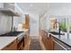 Spacious kitchen featuring an island, stainless steel appliances, and ample cabinet space at 1801 W 33Rd Ave, Denver, CO 80211