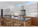 Modern kitchen featuring stainless steel appliances, sleek countertops, and an eat-in island at 1801 W 33Rd Ave, Denver, CO 80211
