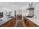 Modern kitchen with stainless appliances, wine fridge, and an open concept design at 1801 W 33Rd Ave, Denver, CO 80211