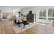 Modern living room featuring a fireplace, large windows, and contemporary furnishings at 1801 W 33Rd Ave, Denver, CO 80211