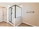 Elegant bathroom with glass-enclosed shower and modern fixtures at 4114 Estrella St, Brighton, CO 80601
