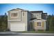 Charming two-story home with a two-car garage, shuttered windows, and a well-manicured lawn at 4114 Estrella St, Brighton, CO 80601