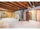 Unfinished basement showing exposed duct work, water heater, and under stair storage at 726 Mobile St, Aurora, CO 80011