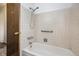 Bathroom includes a bathtub with shower and safety bar at 726 Mobile St, Aurora, CO 80011