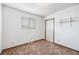 Bedroom features a window, closet, and shelves at 726 Mobile St, Aurora, CO 80011