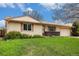 Inviting single-story home with green lawn and mature trees on a bright, sunny day at 726 Mobile St, Aurora, CO 80011