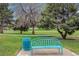 Inviting park bench and trash receptacle in a green community space at 726 Mobile St, Aurora, CO 80011