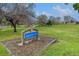 Sign for Apache Mesa Park with grass and trees in the background at 726 Mobile St, Aurora, CO 80011