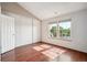 Bright bedroom with hardwood floors, and large windows with nice views at 9679 W Chatfield Ave # C, Littleton, CO 80128