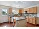 Kitchen with granite countertops, a breakfast bar island, and modern appliances at 9679 W Chatfield Ave # C, Littleton, CO 80128