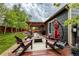 Outdoor living space with pergola, comfortable seating, and well-manicured lawn at 13642 Wrangler Way, Mead, CO 80542